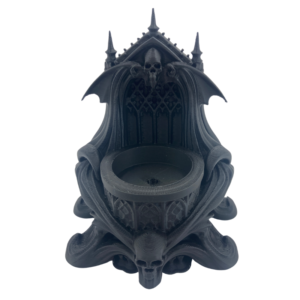 Matte black 3D printed skull candle holder with skulls and bat wings. Gothic cathedaral LED candle holder for altar decor.