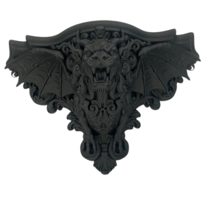 3d printed in matte black a manticore shelf with the head of a lion, torso of a human and bat wings. Surrounded by baroque scrollwork.