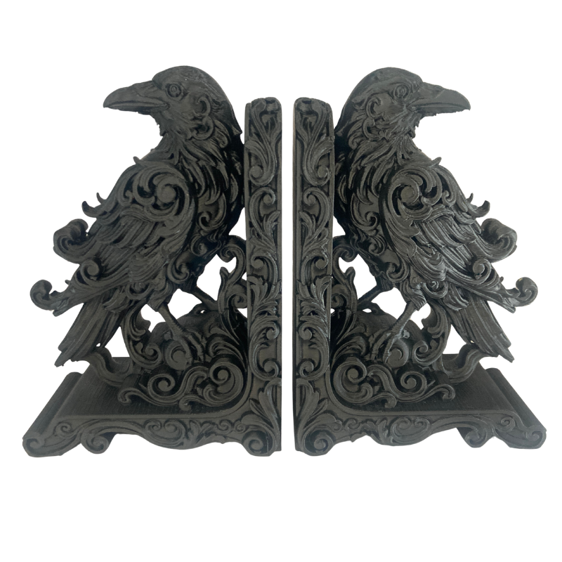 Black 3d printed raven bookends with detailed scrollwork.