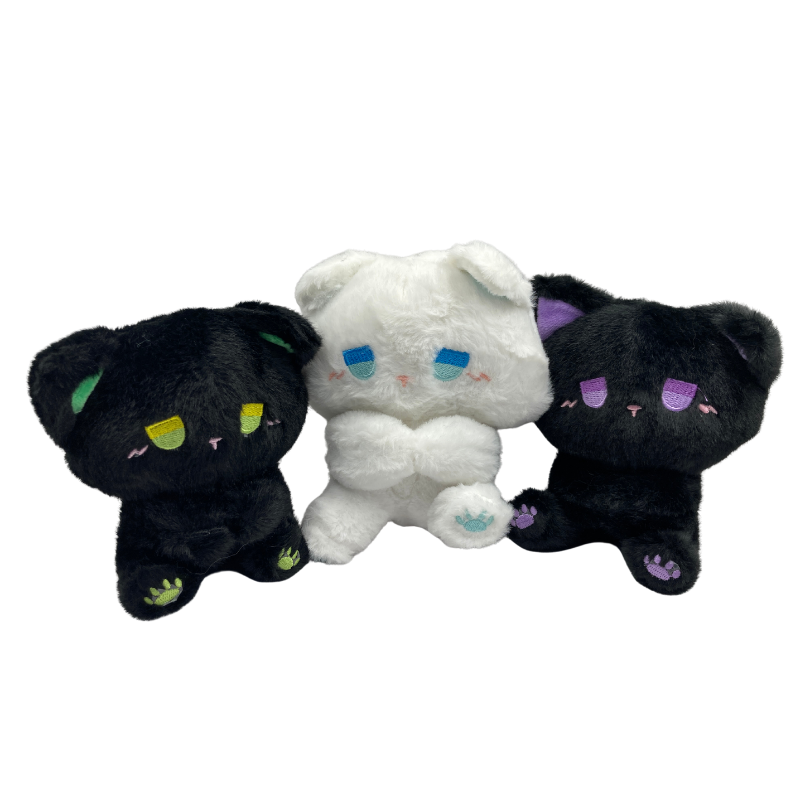 Cute and sad goth kitten plushie with large tearful eyes and floppy ears, available in various colors to fit a dark alternative aesthetic.