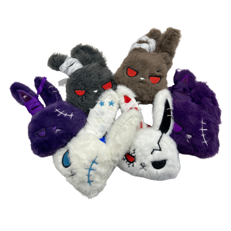 Small bunny head plush with evil eyes, cross faces and piercings, available in various colours.